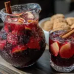 cozy apple cider sangria with cinnamon sticks - featured image
